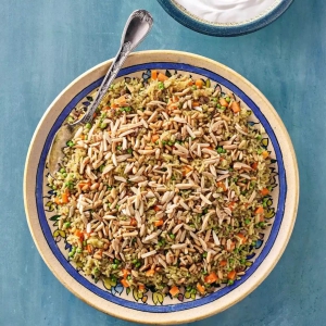 Ouzi rice with lamb, peas and carrots
